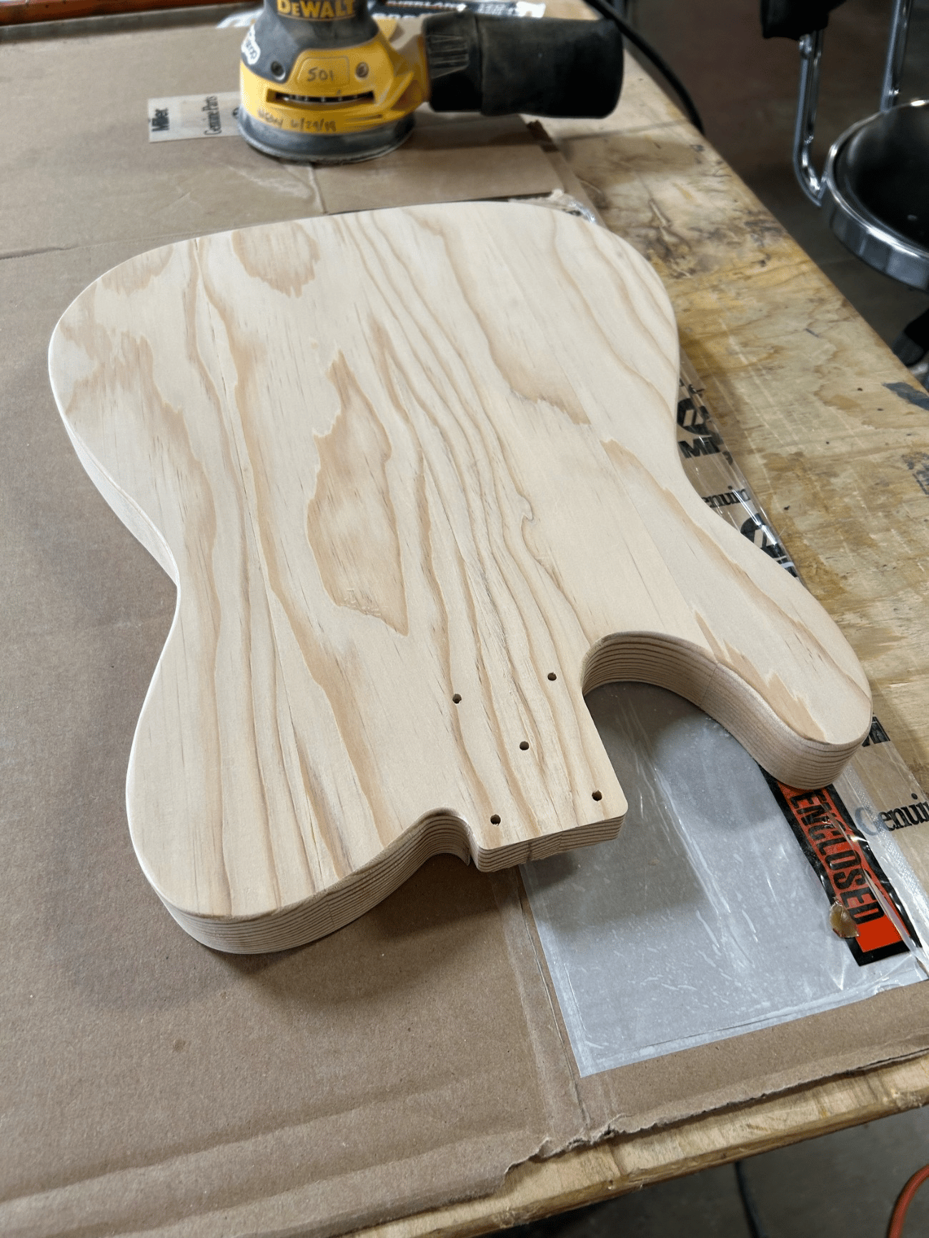 Fig. 2 · The outline cut and faired to the line and the edges rounded over, with the face sanded clean through the grits to take dye evenly.