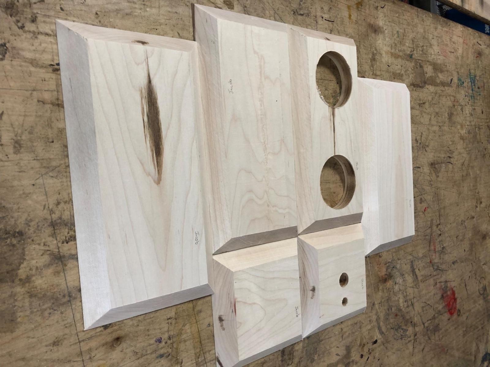 Fig. 2 · Mitered wall panels with the driver openings bored on the drill press, cut to the dimensions taken from the model.